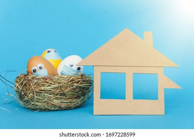 Stay Home At Easter Holiday, Easter Colored Eggs In Face Mask And House Quarantine Concept Celebrate Safely During Coronavirus  Pandemic