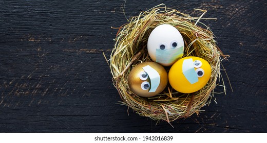 Stay Home At Easter Holiday, Easter Colored Eggs In Face Mask And House Quarantine, Lockdown  Concept Of Coronavirus Covid 19 Pandemic