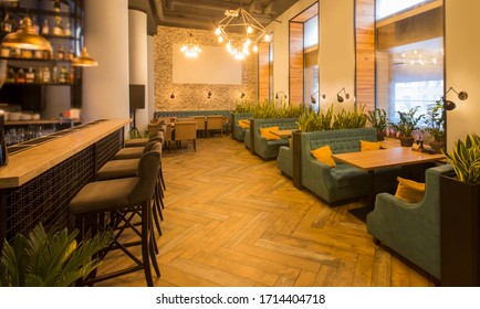 Stay At Home And Order Take Away. Modern Restaurant Interior With Tables And Sofas, Bar Counter, No People, Copy Space