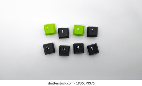 Stay home sign word  made and two color keyboard keycaps  white  grey gradient background