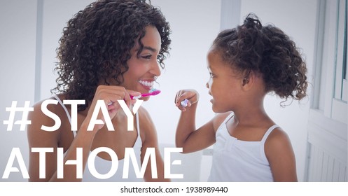 Stay home text over smiling senior mother with daughter brushing teeth. covid 19 pandemic and social distancing concept digitally generated image.