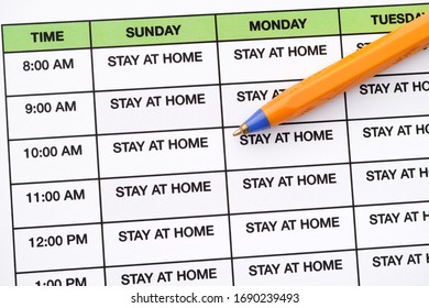 Stay At Home Written In Every Day On A Daily Schedule. Coronavirus Outbreak And Pandemic Concept. Close Up.