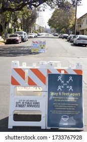 Stay Six Feet Apart Sign Onthe Road At Los Angeles