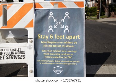 Stay Six Feet Apart Sign Onthe Road At Los Angeles