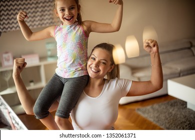 Stay Strong. Mother And Daughter At Home.