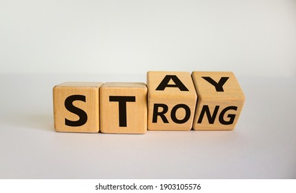 Stay Strong Symbol. Turned Wooden Cubes With Words 'stay Strong'. Beautiful White Background. Motivational, Business And Stay Strong Concept. Copy Space.