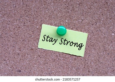 Stay Strong Words On Stick Note And Pinned To A Cork Notice Board. Business Concept.