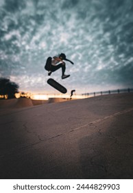staying active doing tricks while skateboarding into the sunset 