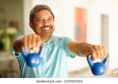 Staying Strong And Feeling Great. Cropped Shot Of A Mature Man Lifting Dumbbells.