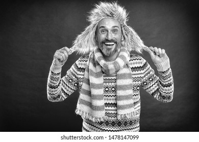 Staying Warm. Bearded Man Accessorizing Sweater With Hat And Scarf. A Winter Ensemble Protects Him From Cold. Winter Wardrobe For Man. Mature Fashion Model Enjoys Cold Weather Style, Vintage Filter.