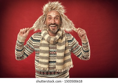 Staying Warm. Bearded Man Accessorizing Sweater With Hat And Scarf. A Winter Ensemble Protects Him From Cold. Winter Wardrobe For Man. Mature Fashion Model Enjoys Cold Weather Style, Vintage Filter.