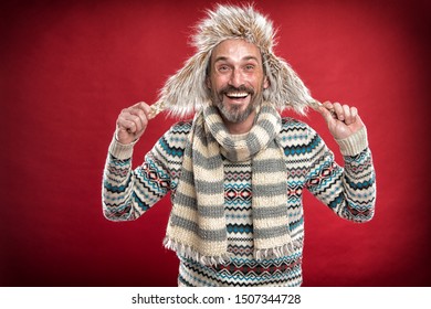 Staying Warm. Bearded Man Accessorizing Sweater With Hat And Scarf. A Winter Ensemble Protects Him From Cold. Winter Wardrobe For Man. Mature Fashion Model Enjoys Cold Weather Style, Vintage Filter.