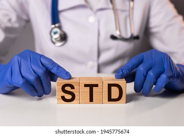 STD Acronym Inscription On Wooden Cubes In Doctor Hands.