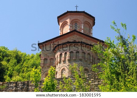 St.Dimitri Church in ancient city of Veliko Tarnovo in Bulgaria against blue sky background.
