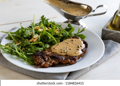 Steak With Arugula And Green Peppercorn Sauce