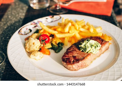 Steak Café De Paris With Herb Butter And French Fries