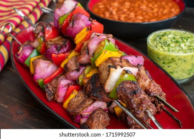 Steak Fajita Skewers With Cilantro Chimichurri: Grilled Beef And Vegetable Kabobs Served With Chimichurri Sauce And Pinto Beans