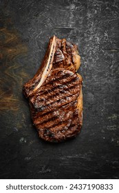 Steak. Grilled steak on the bone. Roasted piece of meat. Free space for text.