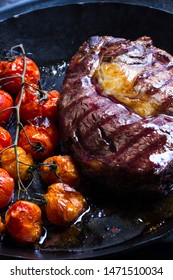 Entrecôte, Steak In An Iron Pan With  Tomatoes