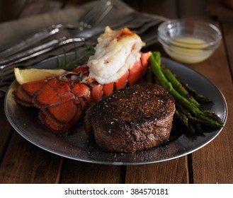 Steak And Lobster Dinner In Low Key Lighting