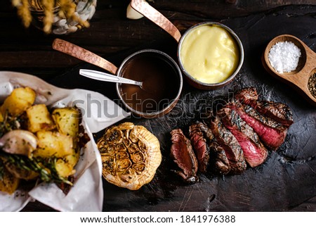 Steak on a wooden cutting board in a steak house Stock foto © 
