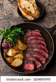 Steak And Potatoes. Grade A Grass Fed Angus Beef Steaks. Tenderloin, Filet Mignon, New York Strip, Bone In Rib-eye Grilled Medium Rare On Outdoor Wood-fired Grill. Classic American Steakhouse Entree.