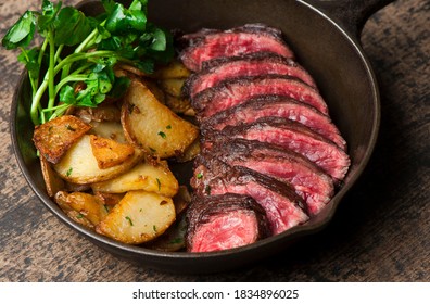 Steak And Potatoes. Grade A Grass Fed Angus Beef Steaks. Tenderloin, Filet Mignon, New York Strip, Bone In Rib-eye Grilled Medium Rare On Outdoor Wood-fired Grill. Classic American Steakhouse Entree.