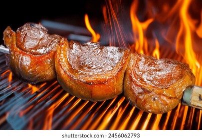 Steak rotisserie at the steakhouse, sliced picanha - Powered by Shutterstock