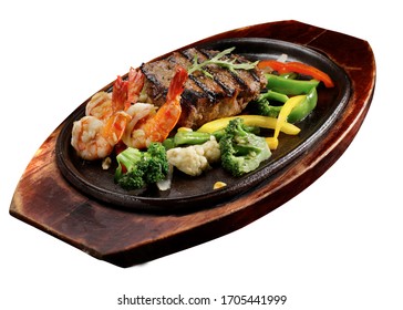 Steak With Shrimp, Fish, Broccoli And Paprika, Served On A Hot Plate.