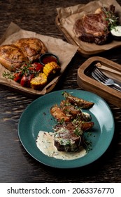 Steakhouse Menu, Assortment Of Meat Meals On Dark Wooden Table