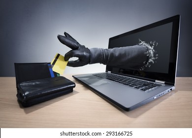 Stealing a credit card through a laptop concept for computer hacker, network security and electronic banking security - Shutterstock ID 293166725