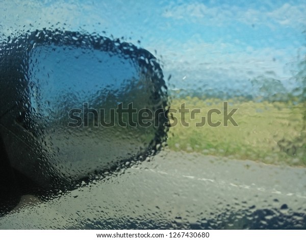 Steam caught in the car\
mirror