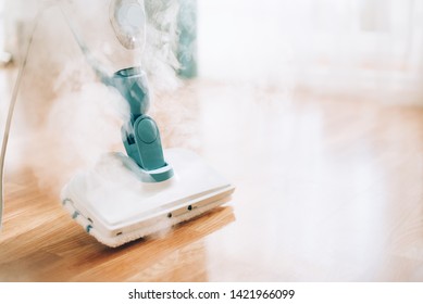 Steam cleaner mop cleaining floor. Banner with copy space. Cleaning service concept. - Shutterstock ID 1421966099