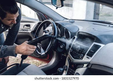 steam cleaning and disinfection of the car interior and air conditioning with a steam cleaner - Shutterstock ID 1831527970