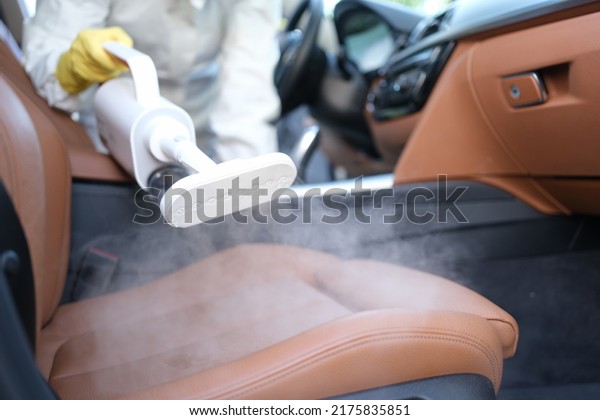Steam cleaning and disinfection of car interiors\
and car seats with steam\
cleaner