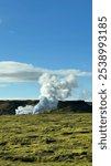 Steam coming out of grounf of a geothermal area in southern iceland. Geothermal vent in iceland.