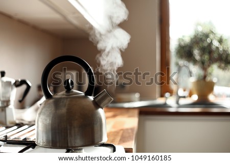 steam coming out of the kettle in the kitchen
