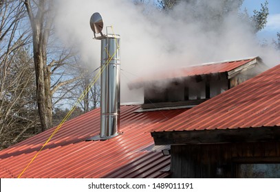 Steam Coming From Stack On Maple Sugar House In Vermont	
