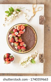 Steam Cooked Cake Decorating With Daisies, Strawberry And Chocolate Sauce.