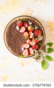 Steam Cooked Cake Decorating With Daisies, Strawberry And Chocolate Sauce.