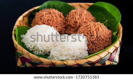Steam cooked string hoppers. String hoppers or Idiappa is a traditional Sri Lankan and South Indian food which is made from rice flour that is squeezed to form thin noodles