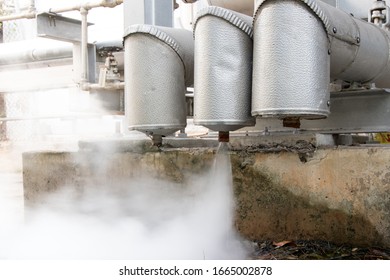 Steam is ejecting from the steam pipe that is insulated.