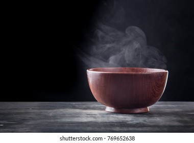 Steam Of Hot Soup In A Soup Bowl With Smoke On Black Background