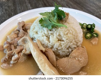 Steam Jasmine Rice Serve With Chicken Stew, Garnish With Vegetables And Chopped Green Chili