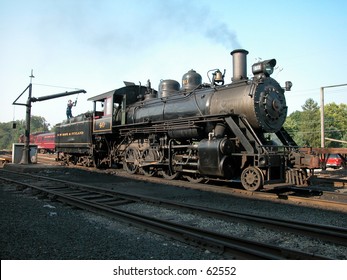 A Steam Locomotive Being Filled With Water At New Hope, PA On The New Hope And Ivyland Railroad.