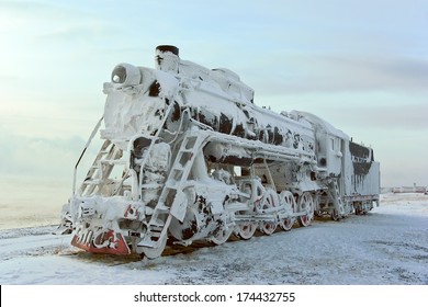 Steam Machine On Train Station, Covered With Snow. Shore Of Lake Baikal (Russia)