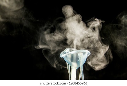 Steam Mist From Nebulizer Or Nebuliser Electrical Machine Drug Delivery Device Used To Administer Medication In The Form Of A Mist Inhaled Into The Lungs Concept. 