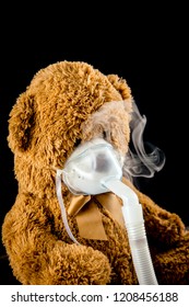 Steam Mist From Nebulizer Or Nebuliser Electrical Machine Drug Delivery Device Used To Administer Medication In The Form Of A Mist Inhaled Into The Lungs Concept. Toy Teddy Bear With Face Mask.