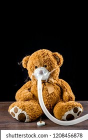 Steam Mist From Nebulizer Or Nebuliser Electrical Machine Drug Delivery Device Used To Administer Medication In The Form Of A Mist Inhaled Into The Lungs Concept. Toy Teddy Bear With Face Mask.