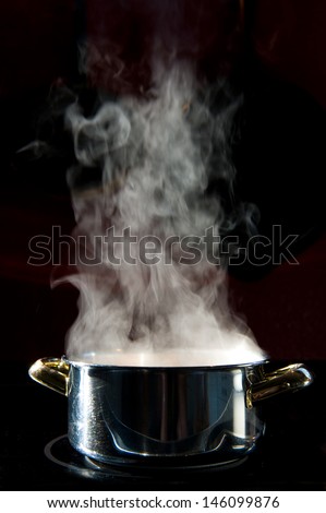 steam over cooking pot